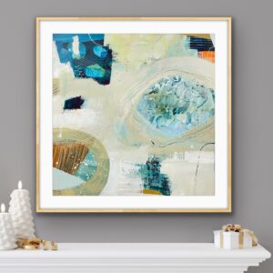 Image of an abstract print in shades of aqua and beige, framed and hanging on a grey wall