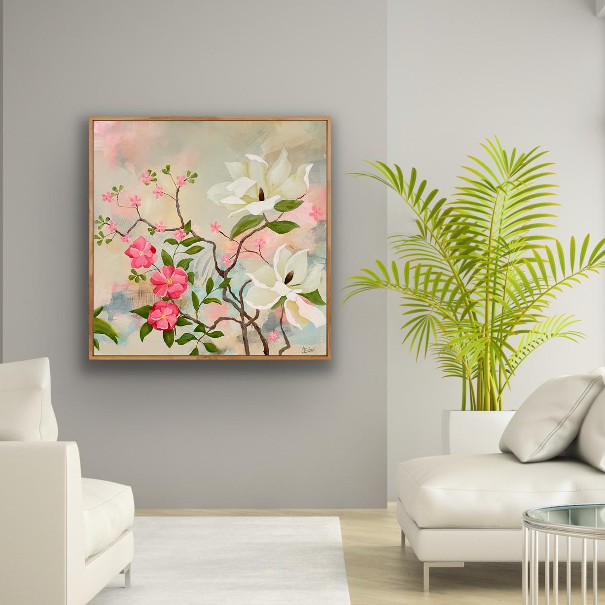 Maytime Magnolias Painting shown framed in a room setting with a potted fern